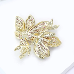 Detailed back view of flower brooch showing alloy structure and secure pin clasp mechanism