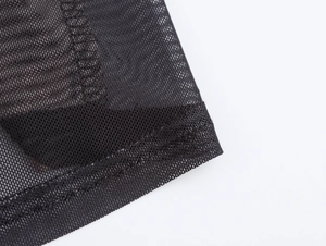 Vue macro d'un tissu en maille noire élégant avec élasticité et détails de couture
