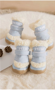 Detail of light blue dog boots with warm lamb wool lining and non-slip rubber soles