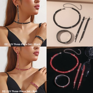 Detail of rhinestone jewelry set including necklace, fringe earrings, and bracelet