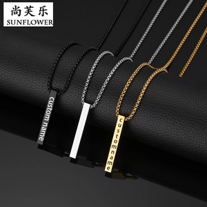 Close-up of personalized stainless steel bar necklaces in black, gold, and silver finishes