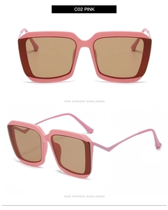 Macro detail of square pink frames with brown lenses and metal hinge of the sunglasses