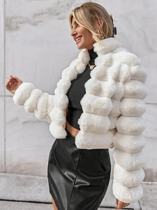Close-up of premium white faux fur coat texture and stylish short puffer sleeve design