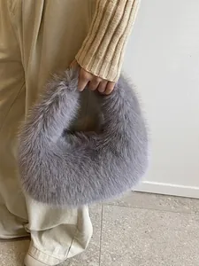 Minimalist grey faux fur handbag with fluffy plush texture and curved top handle design