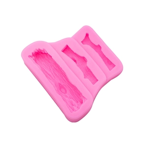 Pink silicone mold featuring various tree bark textures for forest themed cake decorating