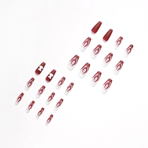 Long coffin press-on nails featuring matte burgundy red, white flame patterns, and 3D bows
