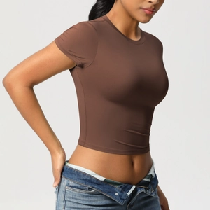Side view of dark brown tight quick-dry yoga crop top showing slim fit silhouette