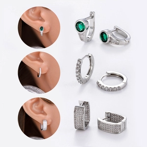 Elegant silver geometric earrings set featuring green stones and pavé cubic zirconia