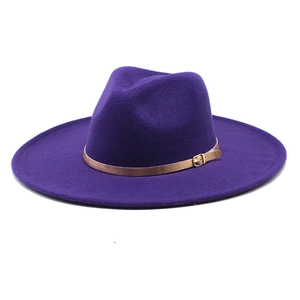 Detail of purple wool fedora hat featuring wide brim and golden buckle ribbon strap