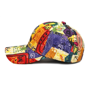 Side view of multi-color graffiti print baseball cap with street style pattern on white backdrop
