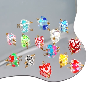 Colorful heart-shaped glass pendants with metal loops for DIY jewelry and necklaces