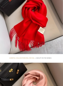 Detail of red and pink 100% Australian wool scarves with elegant long fringe texture