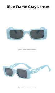 Detail of square blue frame sunglasses with unique flame-patterned hollow temples and gray lenses