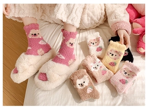 Detailed view of warm coral fleece mid-tube socks with cute cartoon bear and strawberry