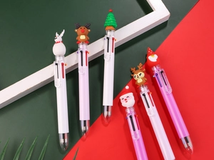 Close-up of 6-color Christmas ballpoint pens with Santa and Reindeer toppers