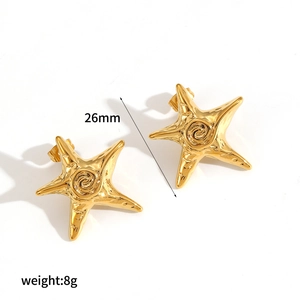 Detailed macro view of 26mm starfish stud earrings in gold finish showing 8g weight