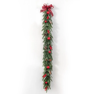 Mixed flocked Christmas garland with red bows, pine cones, and berries for wall decor