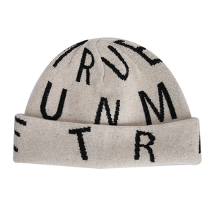 Beige knit beanie for women featuring black letter patterns and folded brim style