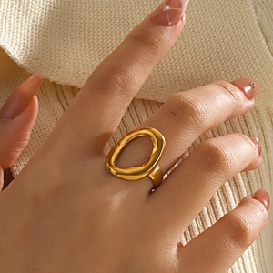 Minimalist gold irregular hollow oval ring with a polished geometric stainless steel finish