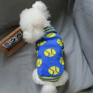 Close-up of blue pet knit sweater featuring yellow tennis patterns and ribbed neck detail