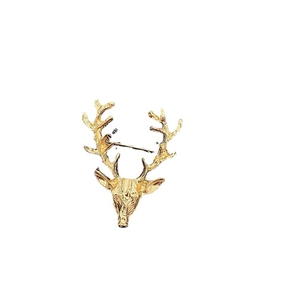 Broche vintage en forme de bois de renne doré pour costumes avec une finition métallique