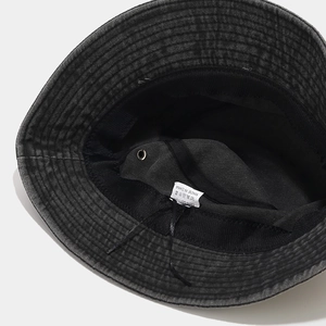 Detailed macro view of 100% cotton inner lining and sweatband of charcoal bucket hat