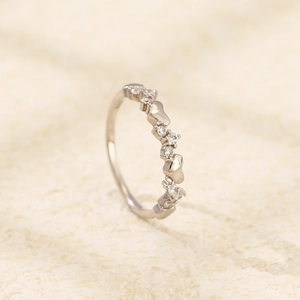 Detailed macro shot of an s925 silver ring featuring irregular sparkling heart diamonds
