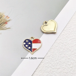 Detail view of 1.6cm heart-shaped US flag charms with golden sandblasted back and loop