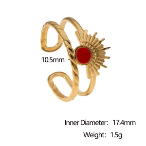 Detail of 18k gold plated sunburst ring with red enamel and dual textured bands