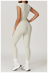 Detail of grey seamless yoga set back view showing high waist pants and slim fit top