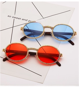 Macro shot of stylish round sunglasses with diamond chain decor and UV400 lenses