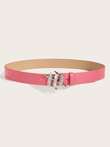 Macro detail of pink leather belt featuring a sparkling rhinestone-encrusted buckle design