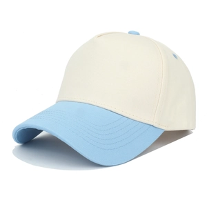 Detail of two-tone trucker hat with cream crown and light blue curved brim