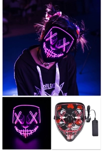 Detail of pink LED mask with X-shaped eyes and battery controller for Halloween party