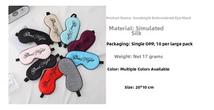 Close-up of imitation silk Goodnight eye mask showing smooth texture and embroidery