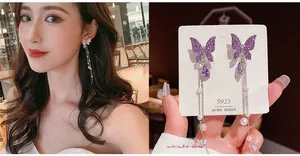 Detail of purple butterfly tassel earrings with S925 silver needles and pearls