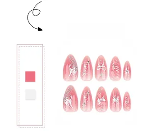 Detail of almond-shaped pink gradient press-on nails with butterfly and pearl accents