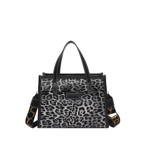 Leopard print tote bag with black handles and detachable shoulder strap for daily use