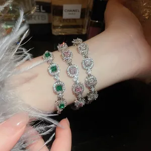 Elegant emerald and pink diamond geometric bracelet with sparkling pavé accents