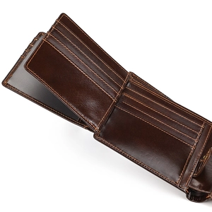 Detail view of genuine leather wallet interior with card slots and a clear ID window