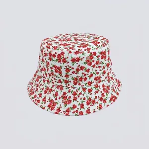 Close-up of small red floral print on white cotton canvas bucket hat for summer