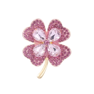 Pink crystal four-leaf clover brooch with gold plating and sparkling rhinestones