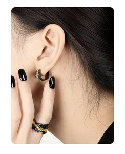 Detail showing the irregular rock texture and two-tone finish on S925 silver jewelry