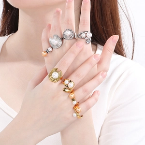 Exaggerated geometric stainless steel ring set with pearl accents in gold and silver finish