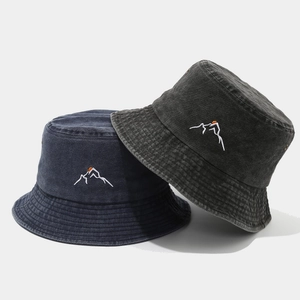 Washed cotton bucket hats with mountain sunset embroidery in navy and dark grey colors