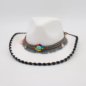 Detail of white western cowboy hat with ethnic beads, turquoise and grey tassels decoration