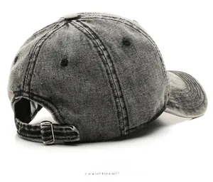 Detail view of the washed grey denim baseball cap showing the adjustable metal back strap