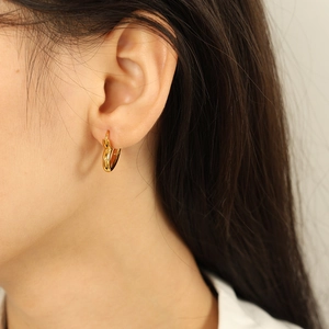 Elegant gold heart-shaped hoop earrings for women showing minimalist and vintage style