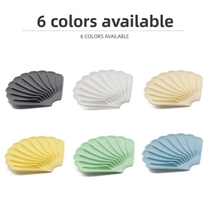 Detailed view of shell-shaped silicone soap dishes in six colors with drainage ridges
