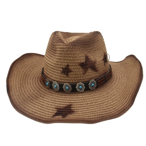 Detail of western straw hat with turquoise beads and star prints on wide brim